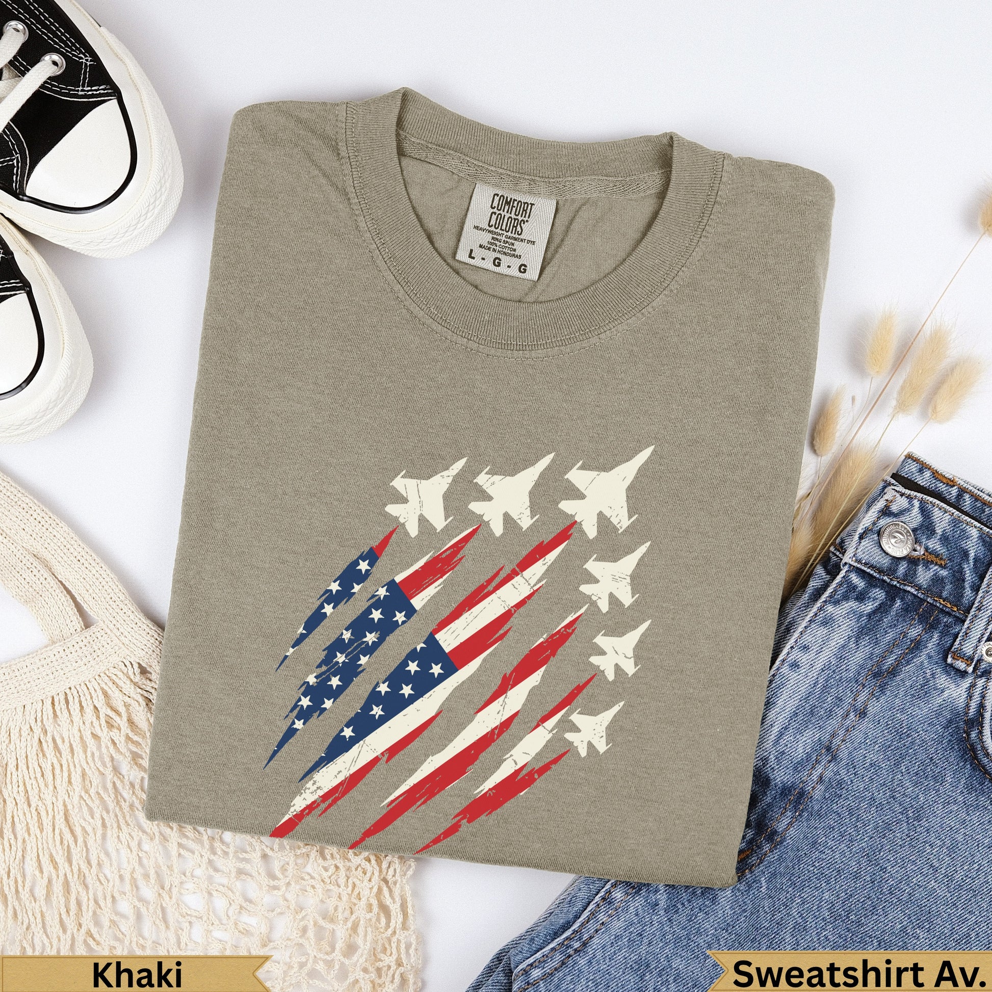 Khaki sweatshirt with distressed American flag jet graphic.