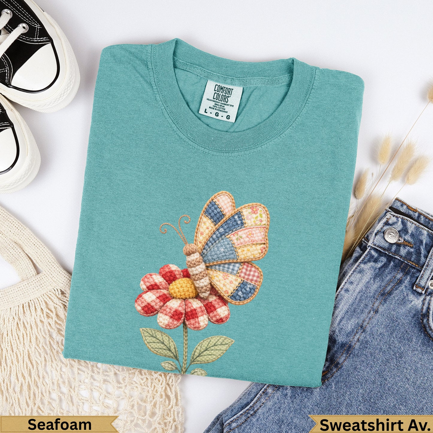 Teal Comfort Colors sweatshirt with quilted butterfly and flower graphic.