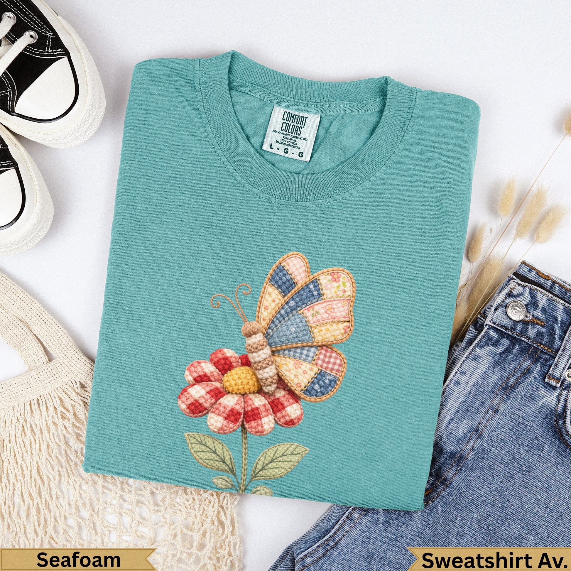 Teal Comfort Colors sweatshirt with quilted butterfly and flower graphic.