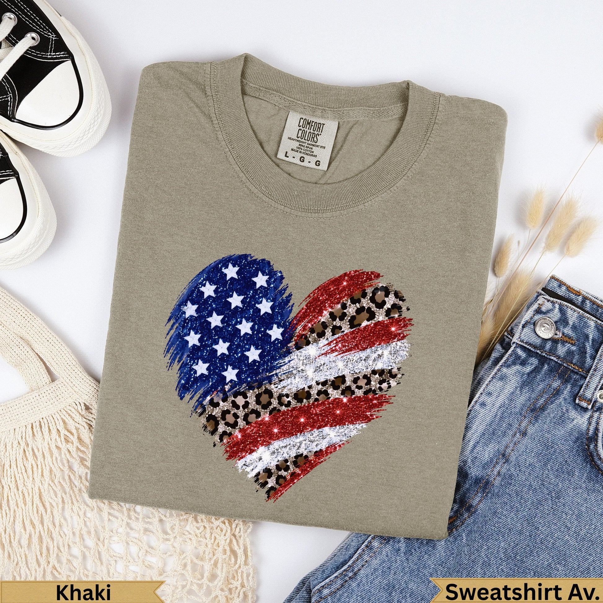 Khaki sweatshirt with distressed American flag heart graphic.