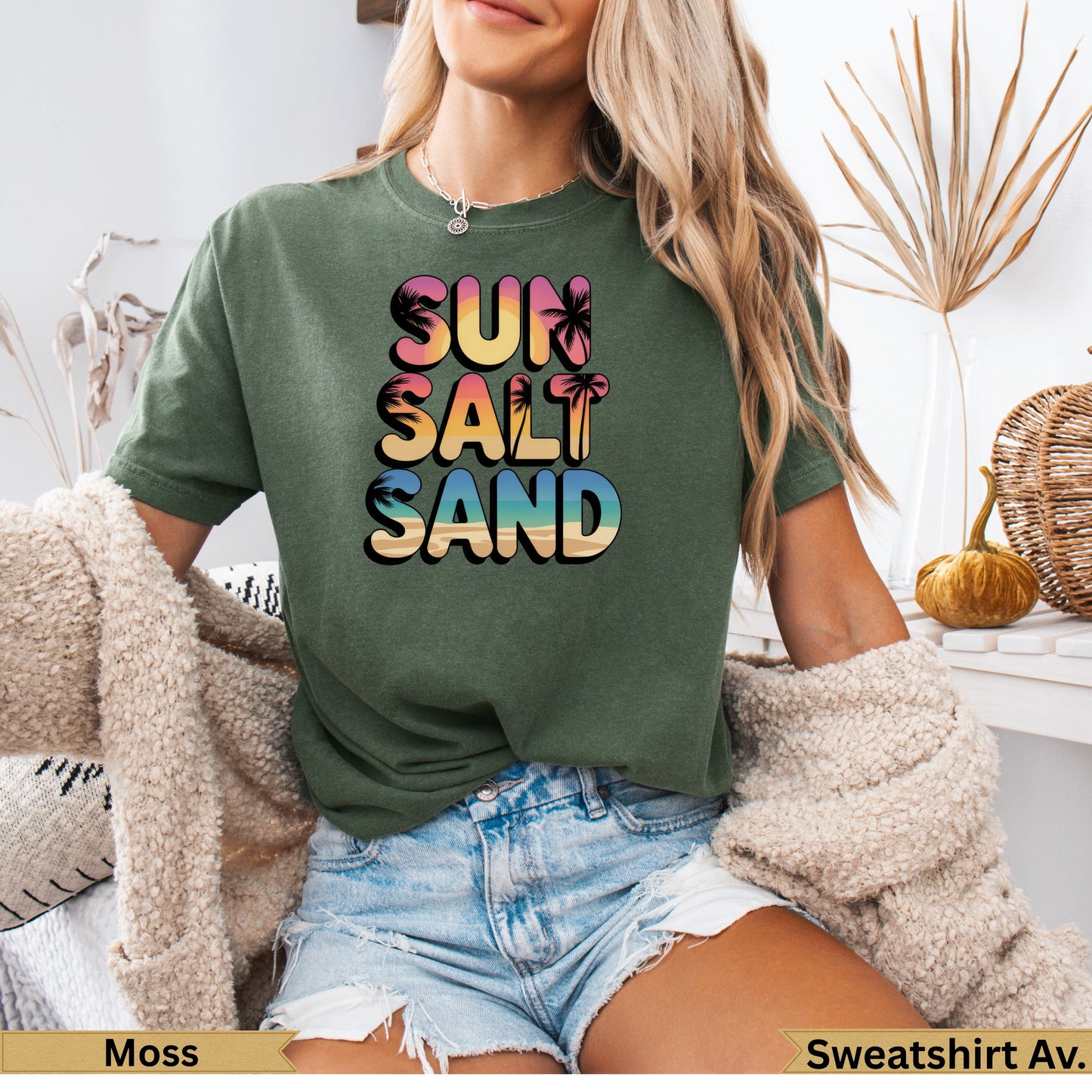 Olive green t-shirt with "SUN SALT SAND" text and palm trees.