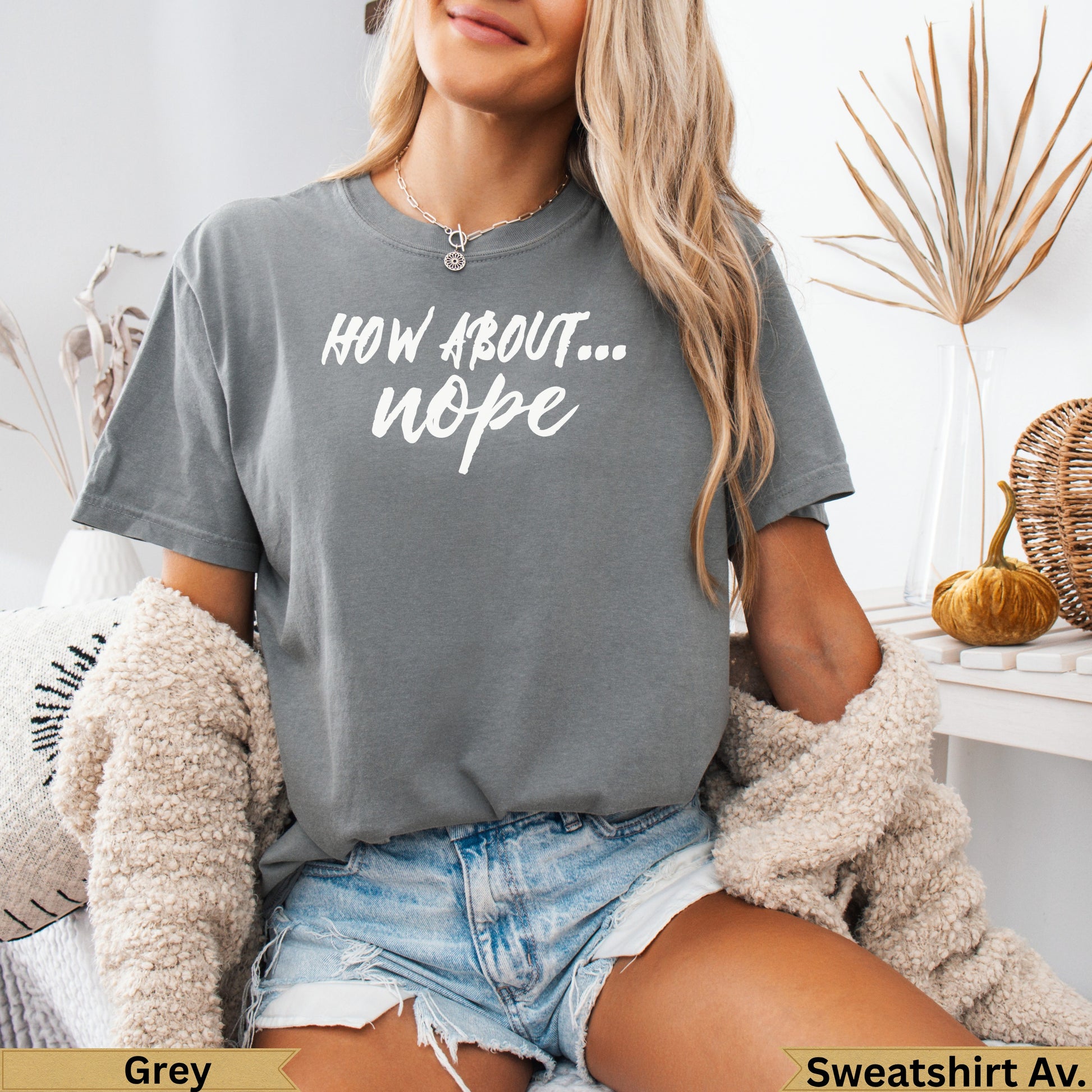 Grey t-shirt with "How about... nope" text, worn by a person.
