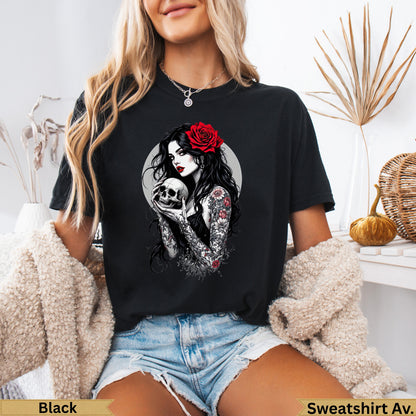 Black graphic t-shirt with skull, rose, and tattooed woman illustration.