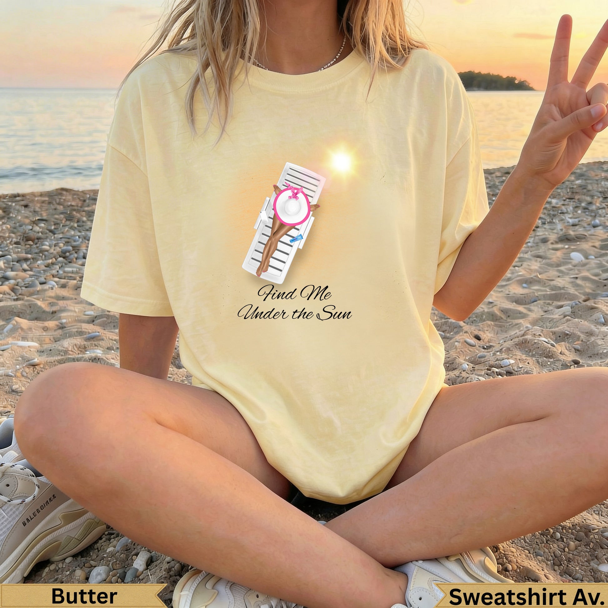 Yellow sweatshirt with "Find Me Under the Sun" text and beach chair graphic.