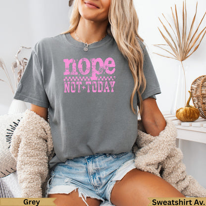 Grey t-shirt with "nope not today" in pink checkerboard text.