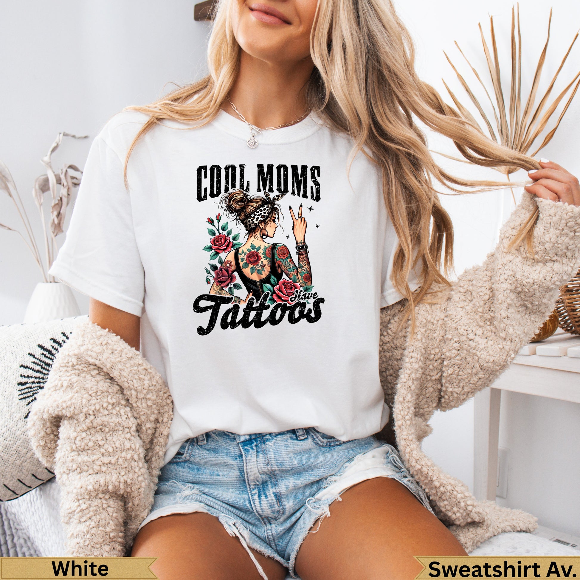 White t-shirt with "Cool Moms Have Tattoos" design and floral tattoo illustration.