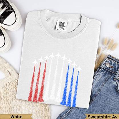 White Comfort Colors crewneck sweatshirt with blue, red, and white jet trails.