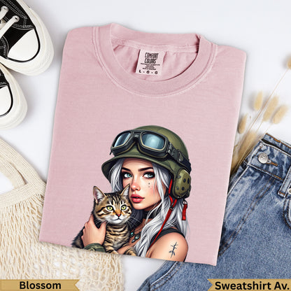 Pink t-shirt with woman in goggles holding cat, "Blossom" and "Sweatshirt Av." text.
