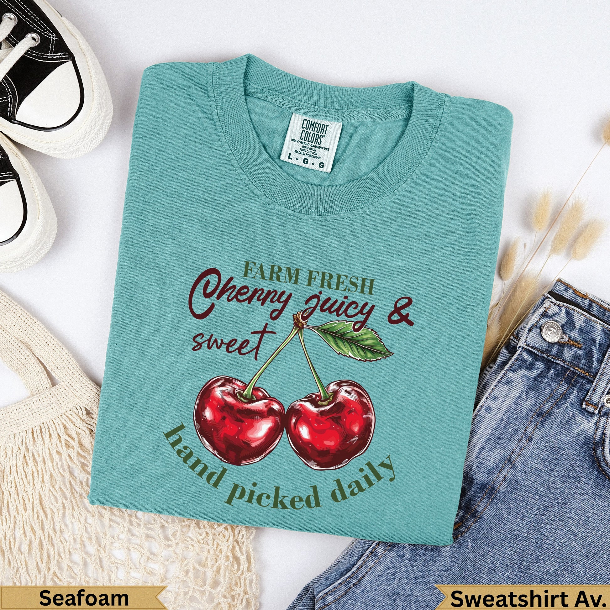 Teal Comfort Colors t-shirt with cherries and "farm fresh juicy & sweet hand picked daily" text.