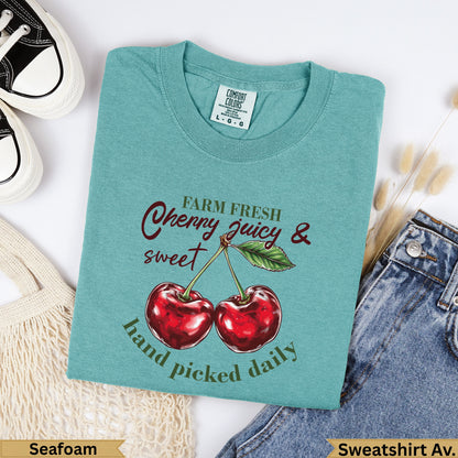 Teal Comfort Colors t-shirt with cherries and "farm fresh juicy & sweet hand picked daily" text.