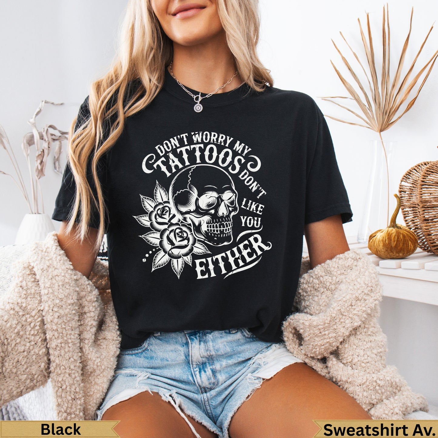 Black t-shirt with skull, roses, and text: "Don't worry my tattoos don't like you either".