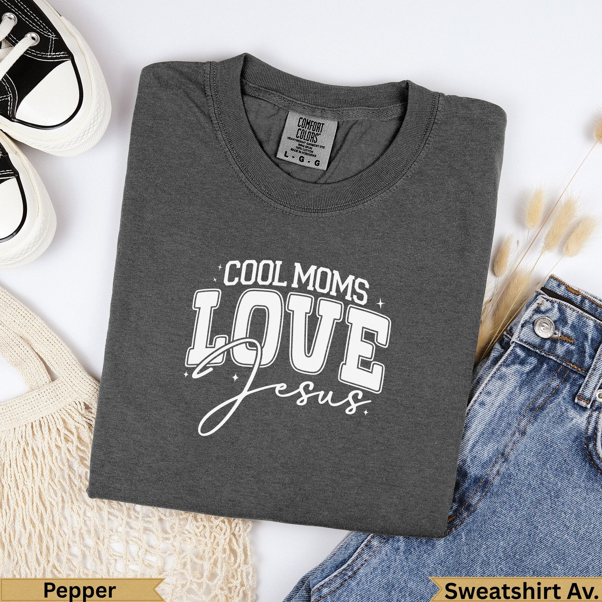 Dark gray Comfort Colors sweatshirt with "Cool Moms Love Jesus" text.