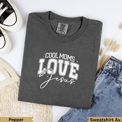 Dark gray Comfort Colors sweatshirt with "Cool Moms Love Jesus" text.