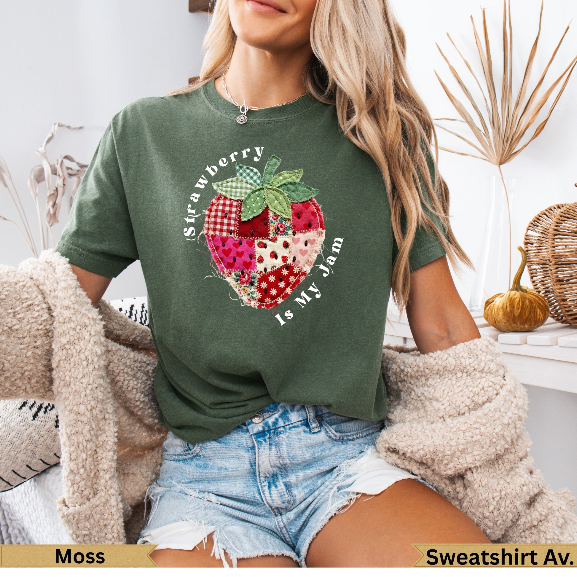 Green t-shirt with a patchwork strawberry graphic and text "Strawberry Is My Jam".