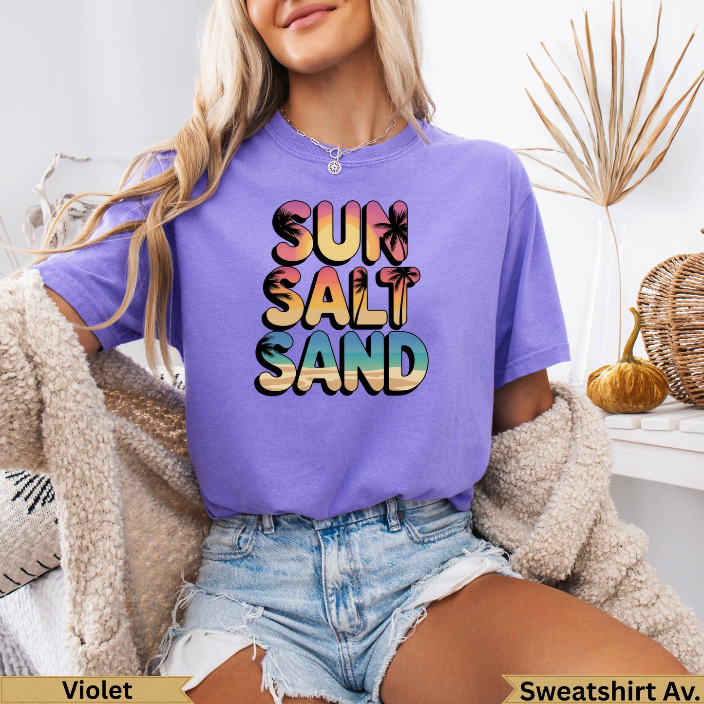 Purple t-shirt with "Sun Salt Sand" text and palm trees.