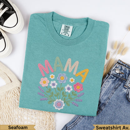 Teal Comfort Colors sweatshirt with embroidered "MAMA" and floral bouquet.