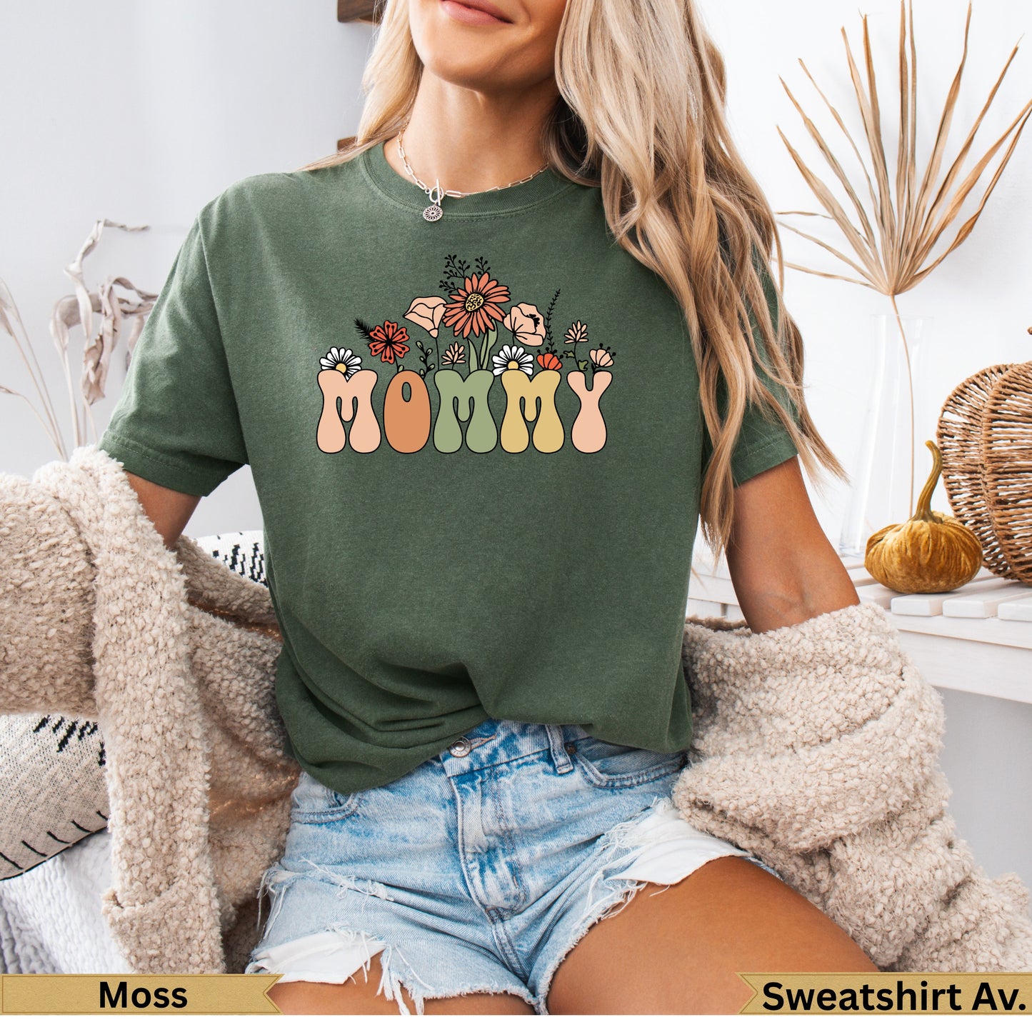 Green t-shirt with "MOMMY" in floral block letters across the chest.