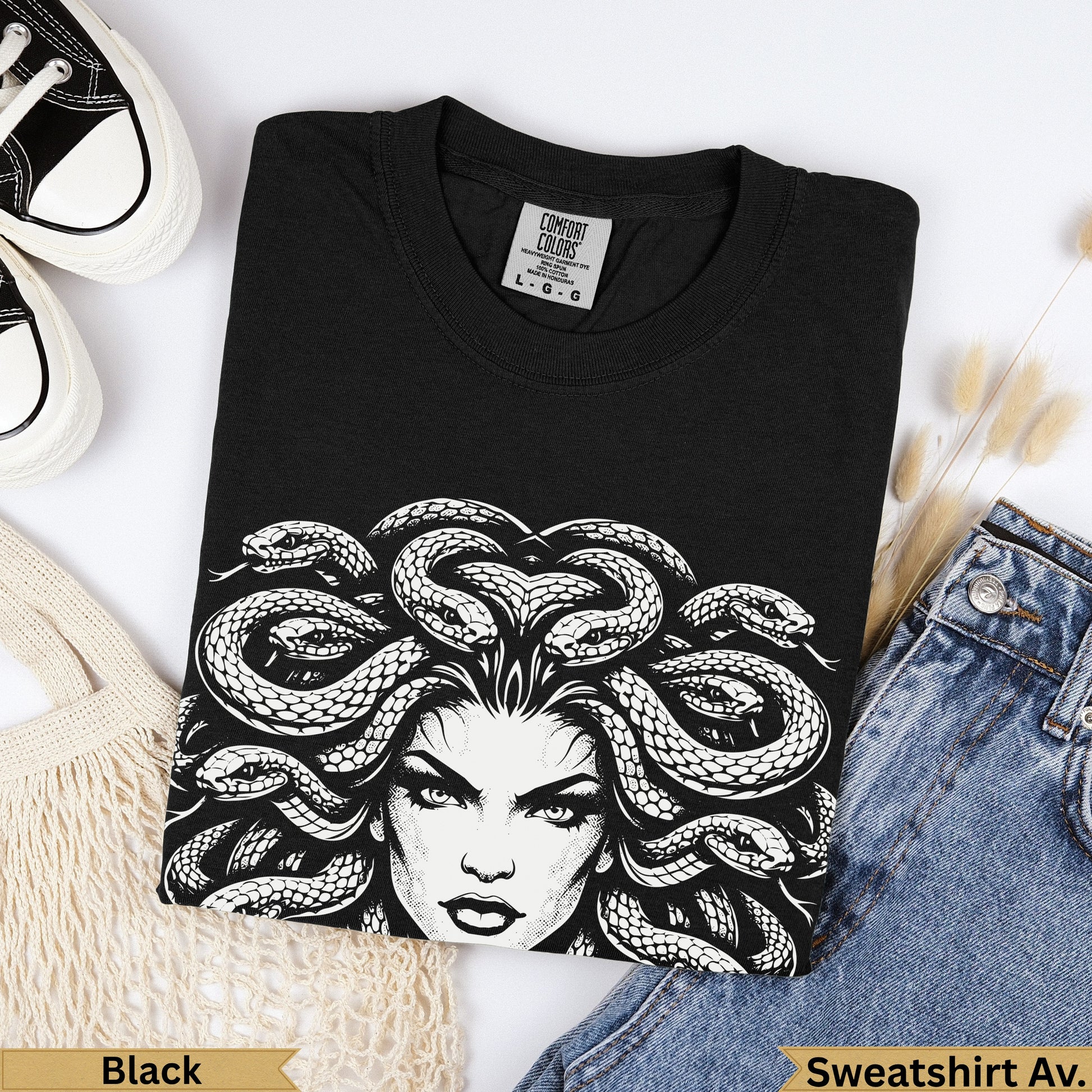 Black Comfort Colors t-shirt featuring Medusa graphic, paired with jeans.