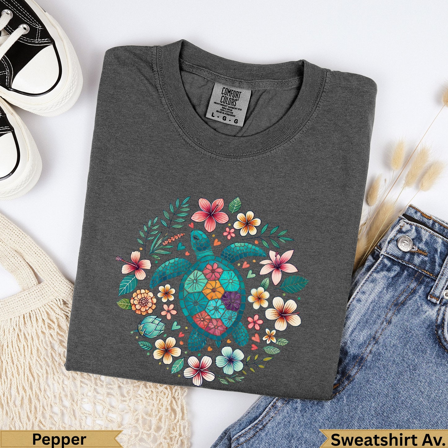 Dark grey crewneck sweatshirt with a teal sea turtle surrounded by colorful flowers.