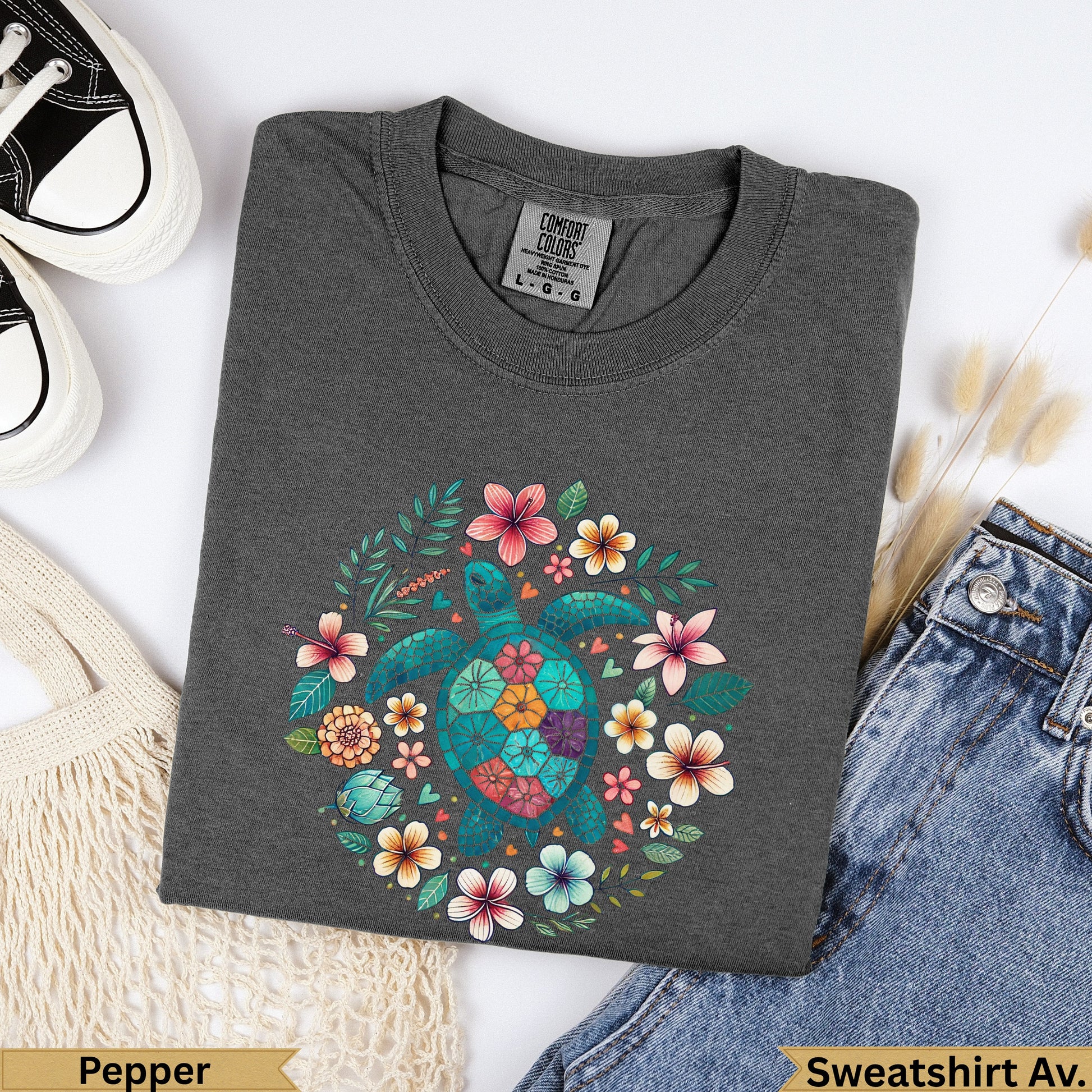 Dark grey crewneck sweatshirt with a teal sea turtle surrounded by colorful flowers.