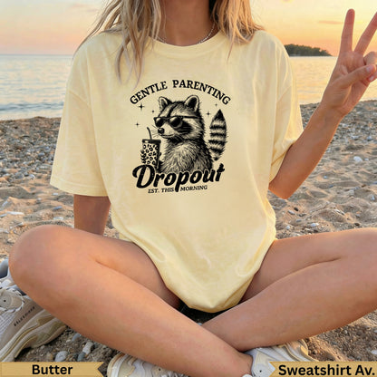Yellow t-shirt with raccoon holding a coffee cup and "Gentle Parenting" text.