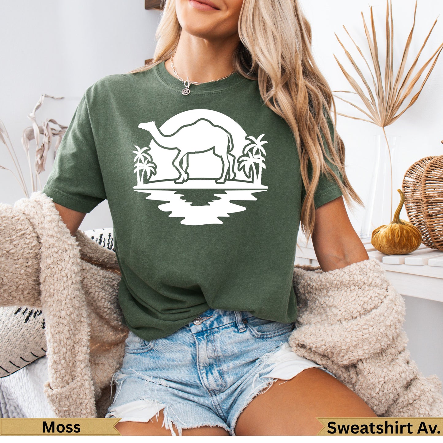 Olive green t-shirt with camel silhouette and palm trees graphic.