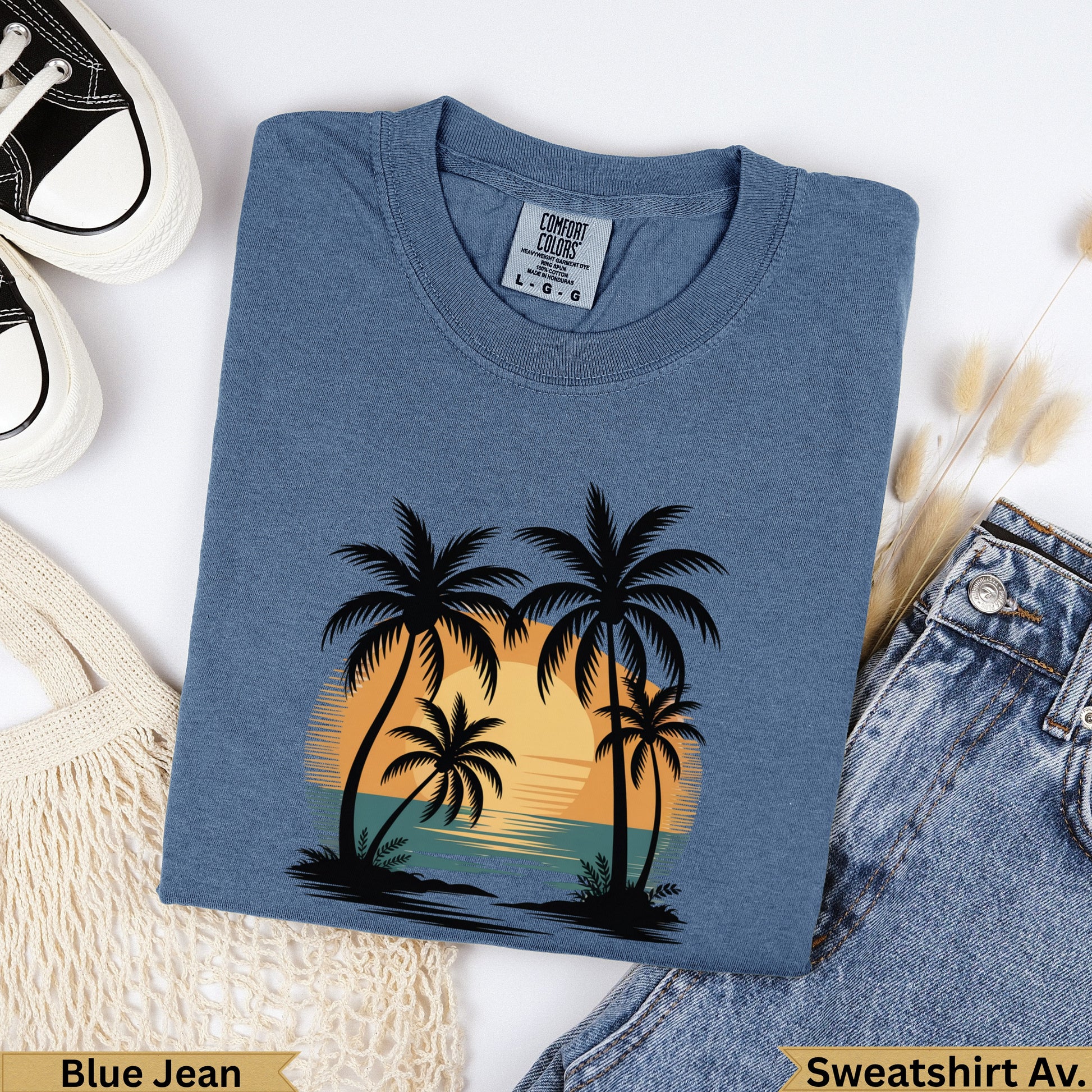 Blue Jean Comfort Colors sweatshirt with palm trees and sunset graphic.