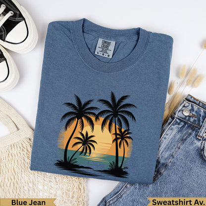 Blue Jean Comfort Colors sweatshirt with palm trees and sunset graphic.