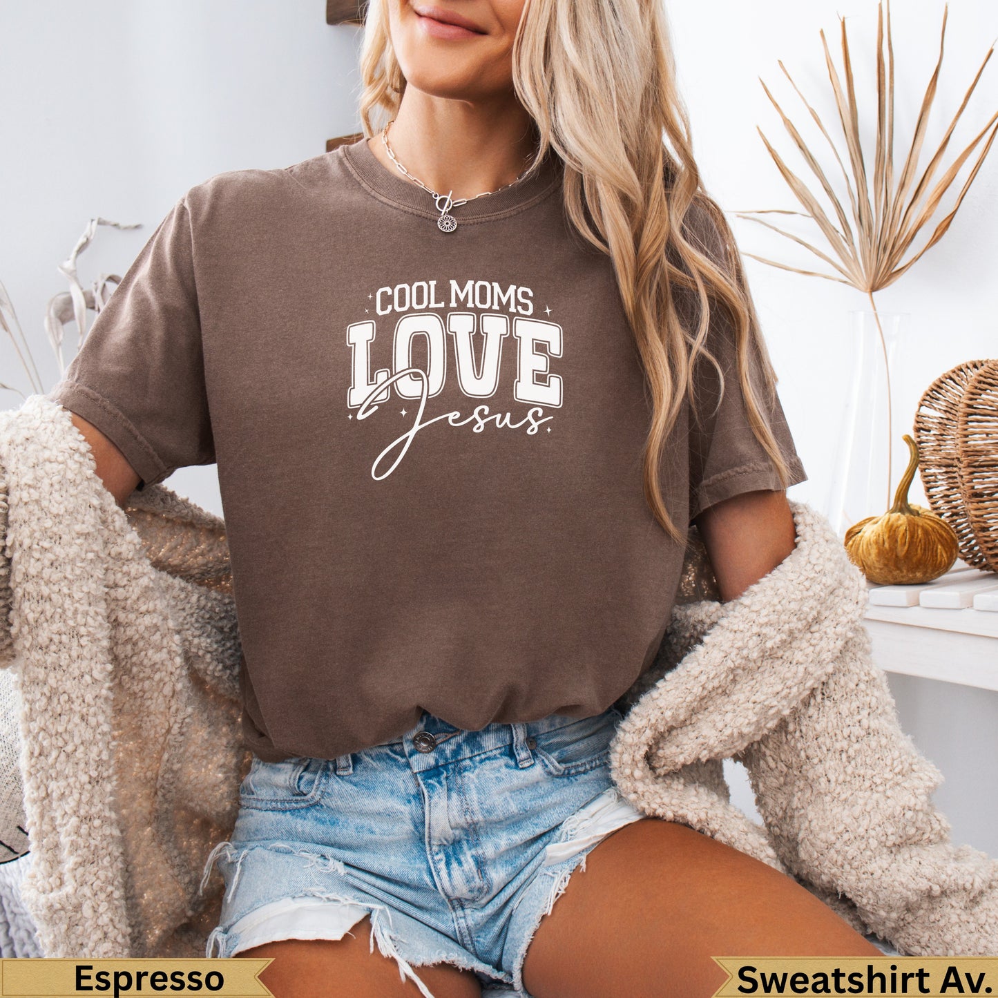 Brown t-shirt with "Cool Moms Love Jesus" text, on a woman.