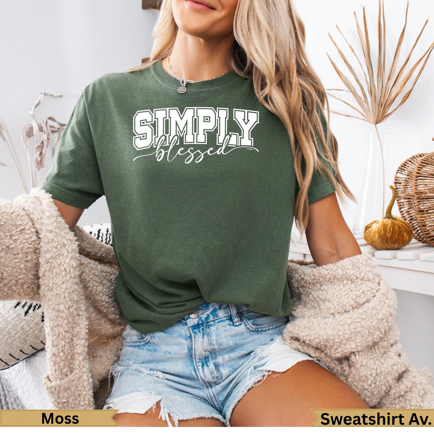 Green crewneck sweatshirt with "SIMPLY BLESSED" text.