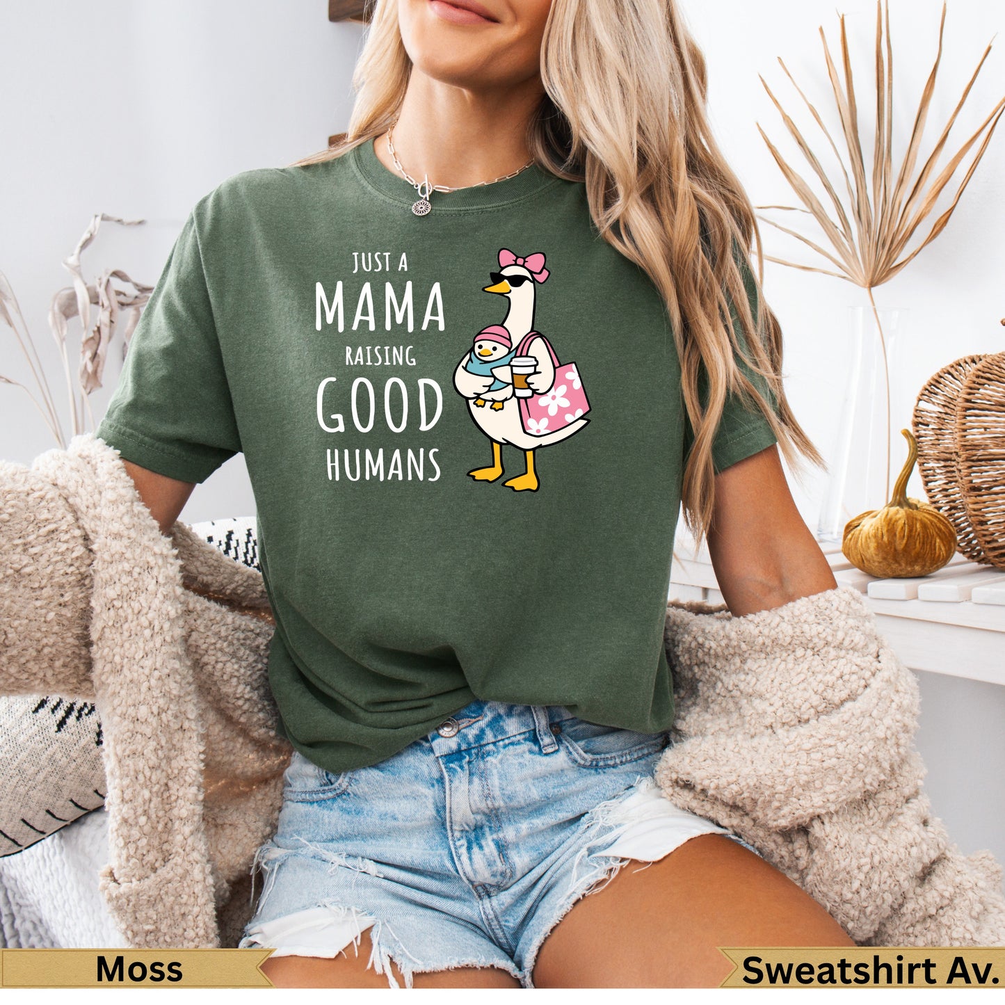 Green t-shirt with "Just a Mama Raising Good Humans" and duck graphic.