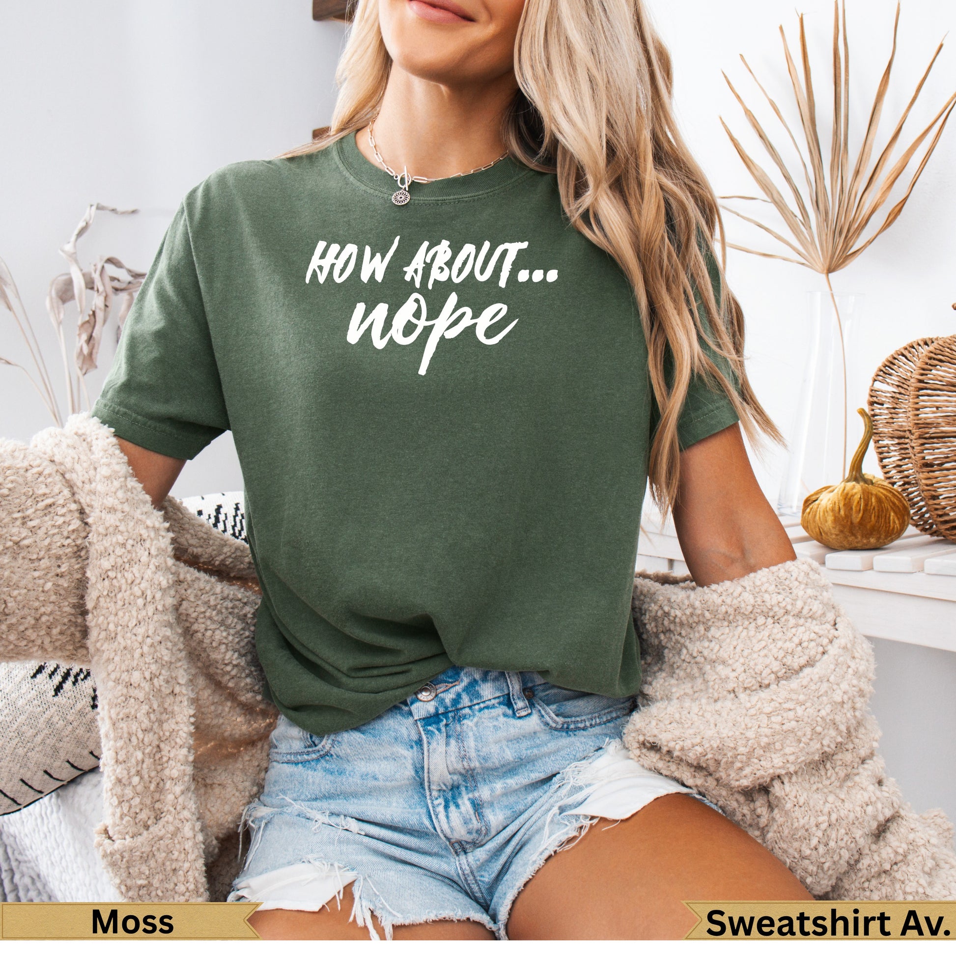 Moss green t-shirt with "HOW ABOUT... nope..." text, worn by a woman.