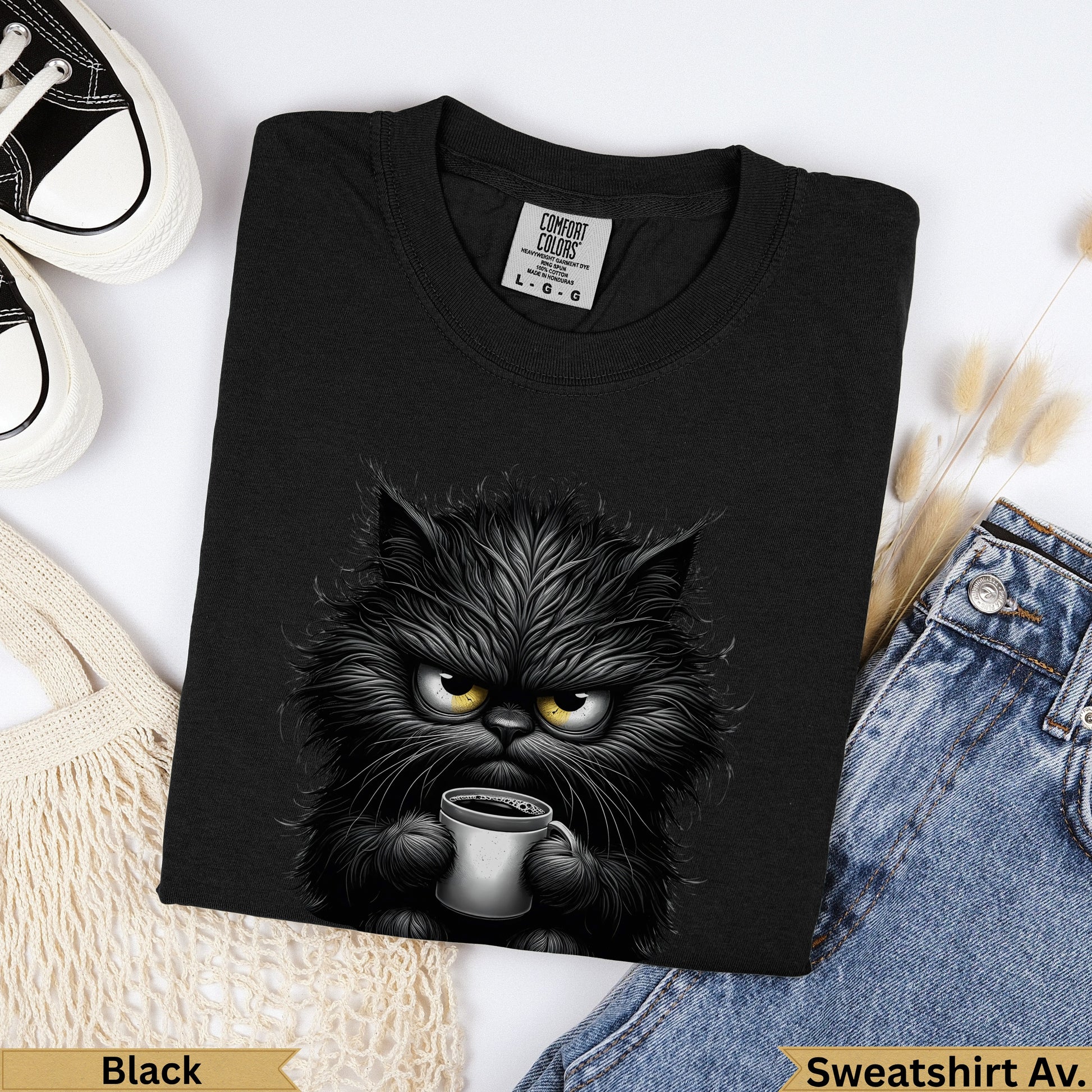 Black Comfort Colors sweatshirt with a grumpy black cat holding a mug.