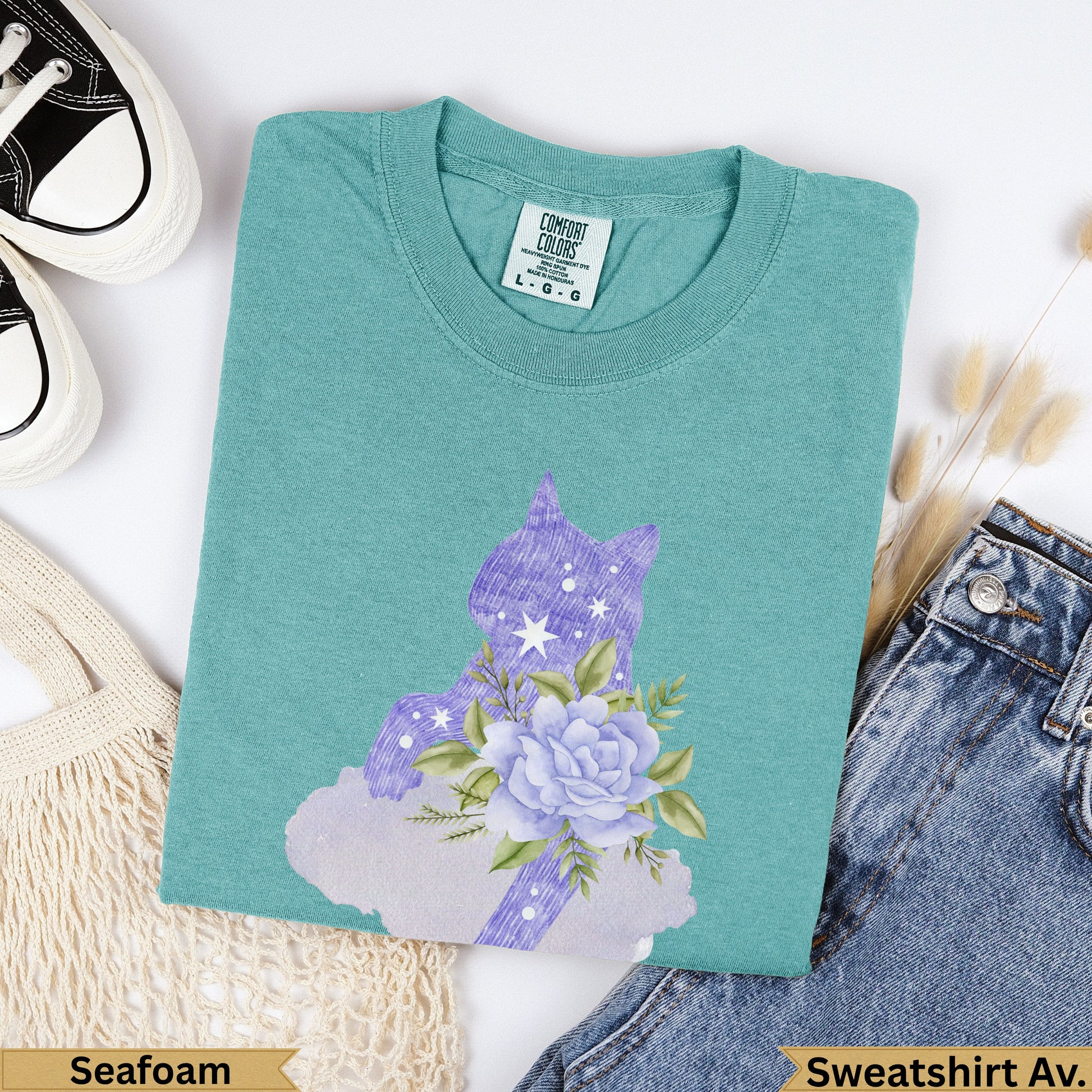 Teal sweatshirt with purple unicorn and flower graphic, "Seafoam" text.
