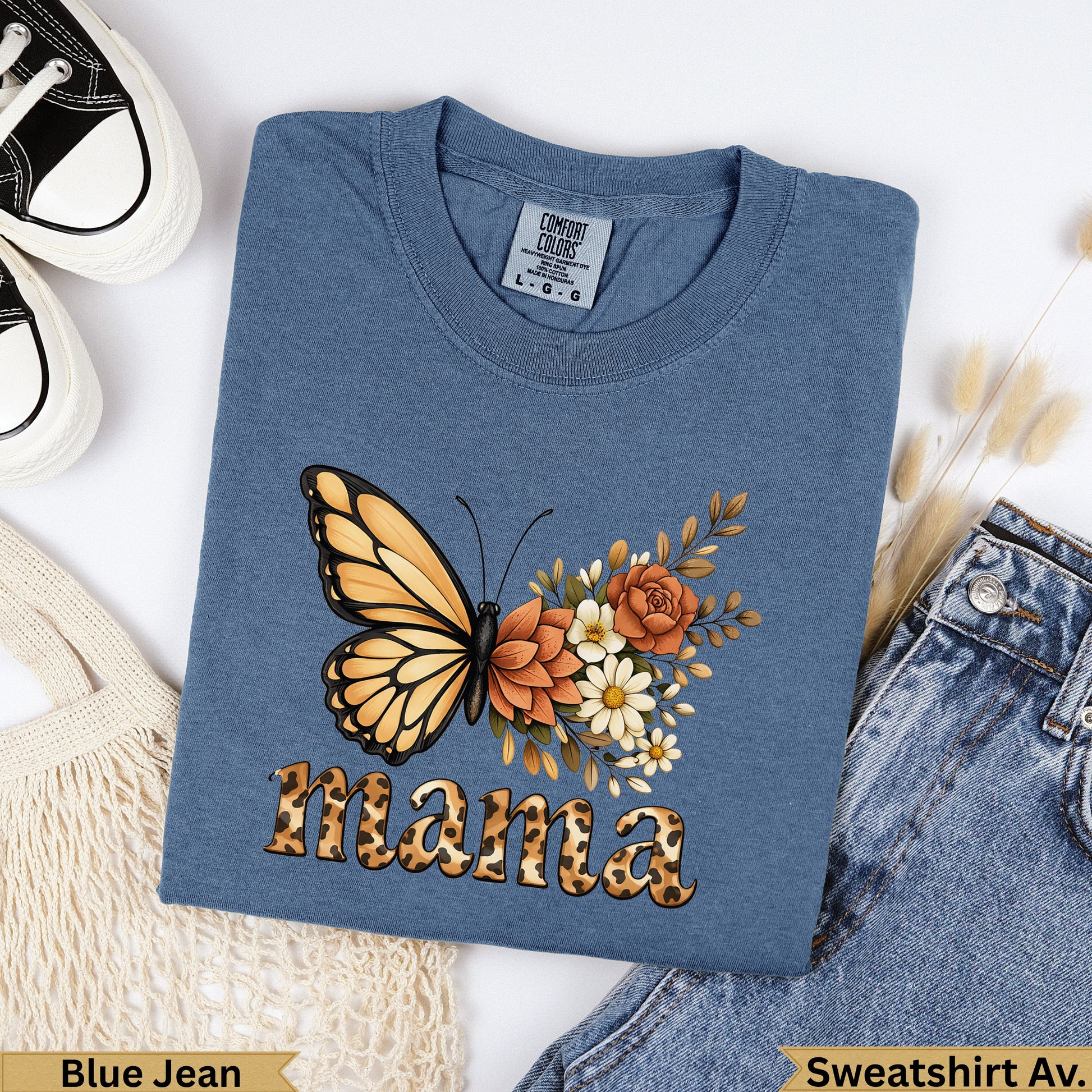 Blue t-shirt with orange butterfly and floral design, reading "Mama".