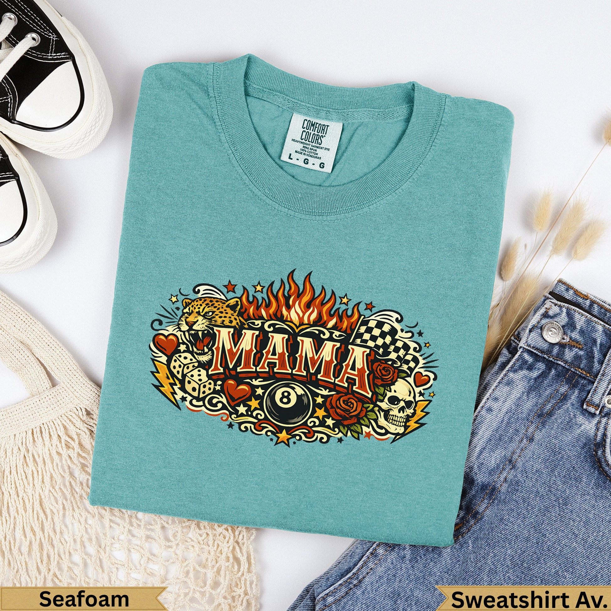 Teal t-shirt with "MAMA" design featuring skulls, roses, and checkered flags.