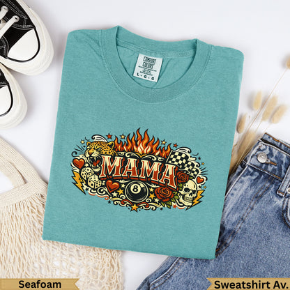 Teal t-shirt with "MAMA" design featuring skulls, roses, and checkered flags.