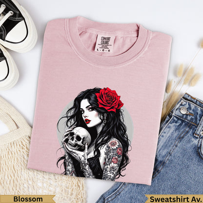 Pink t-shirt with woman holding skull and rose tattoo art.