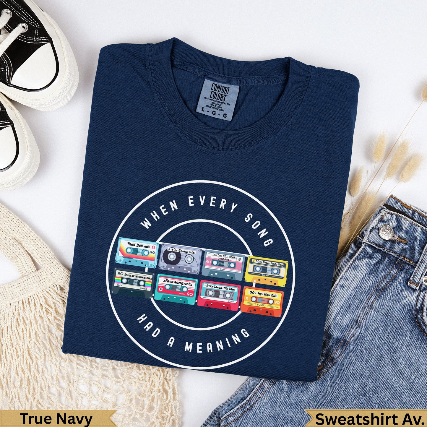 Navy t-shirt with "When Every Song Had A Meaning" and colorful 90s mixtape graphics.