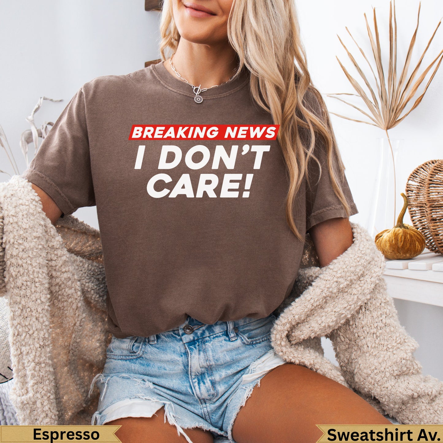 Brown t-shirt with white text "BREAKING NEWS I DON'T CARE!".