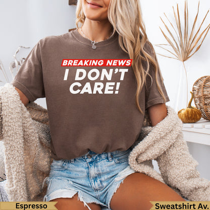 Brown t-shirt with white text "BREAKING NEWS I DON'T CARE!".