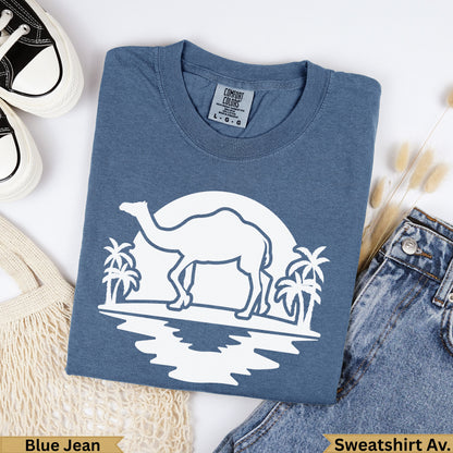 Blue Jean Comfort Colors t-shirt with camel and palm trees graphic.