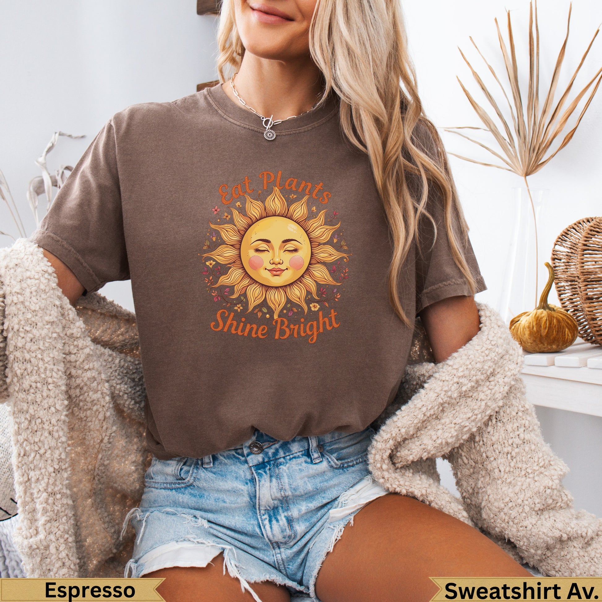 Brown t-shirt with sun graphic and "Eat Plants Shine Bright" text.