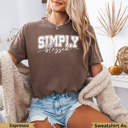 Woman wearing a brown "SIMPLY blessed" graphic t-shirt and denim shorts.
