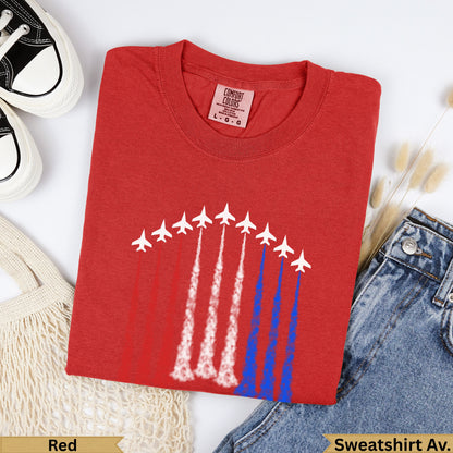 Red t-shirt with white fighter jets creating red and blue smoke trails.