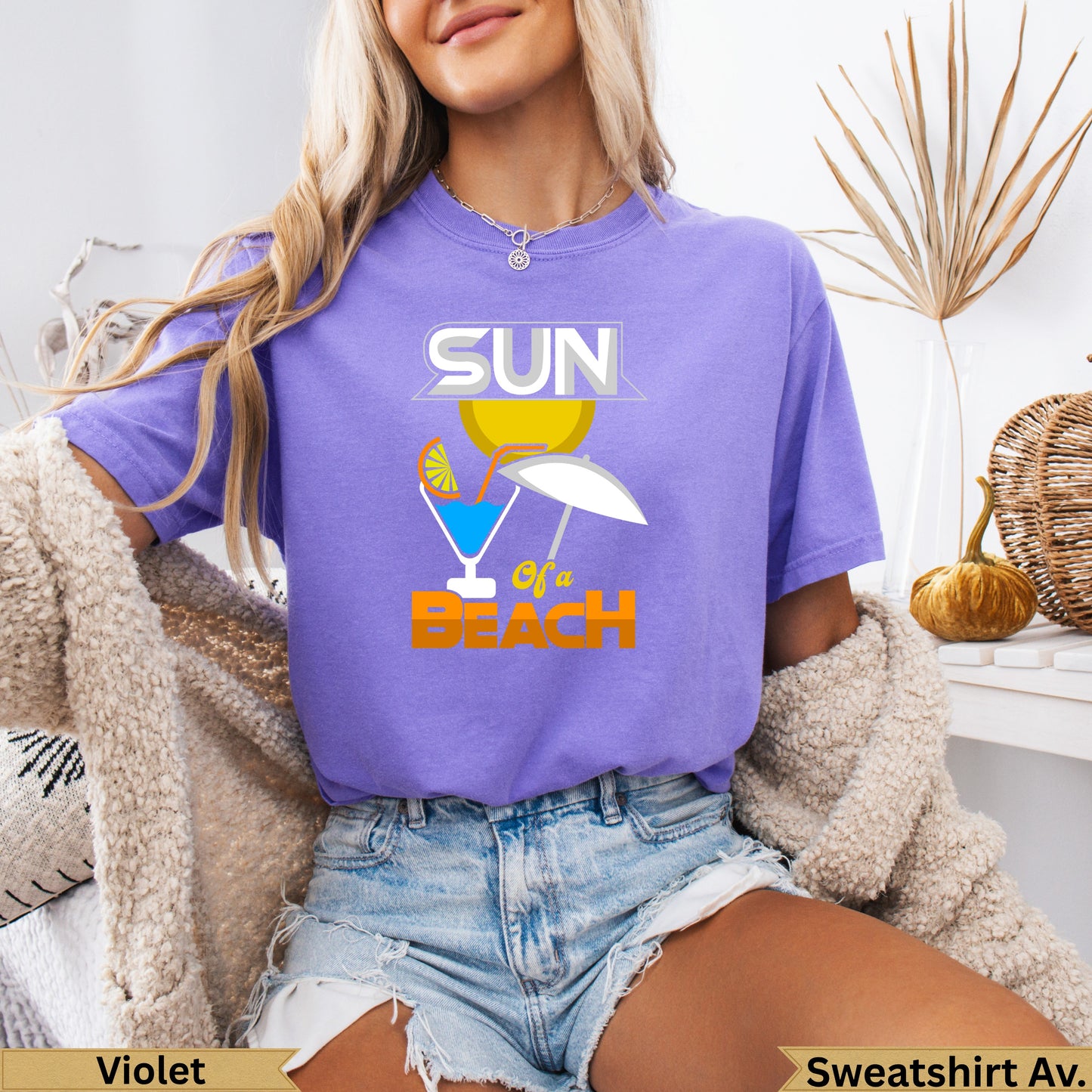 Violet crewneck sweatshirt with "SUN OF A BEACH" graphic and cocktail.