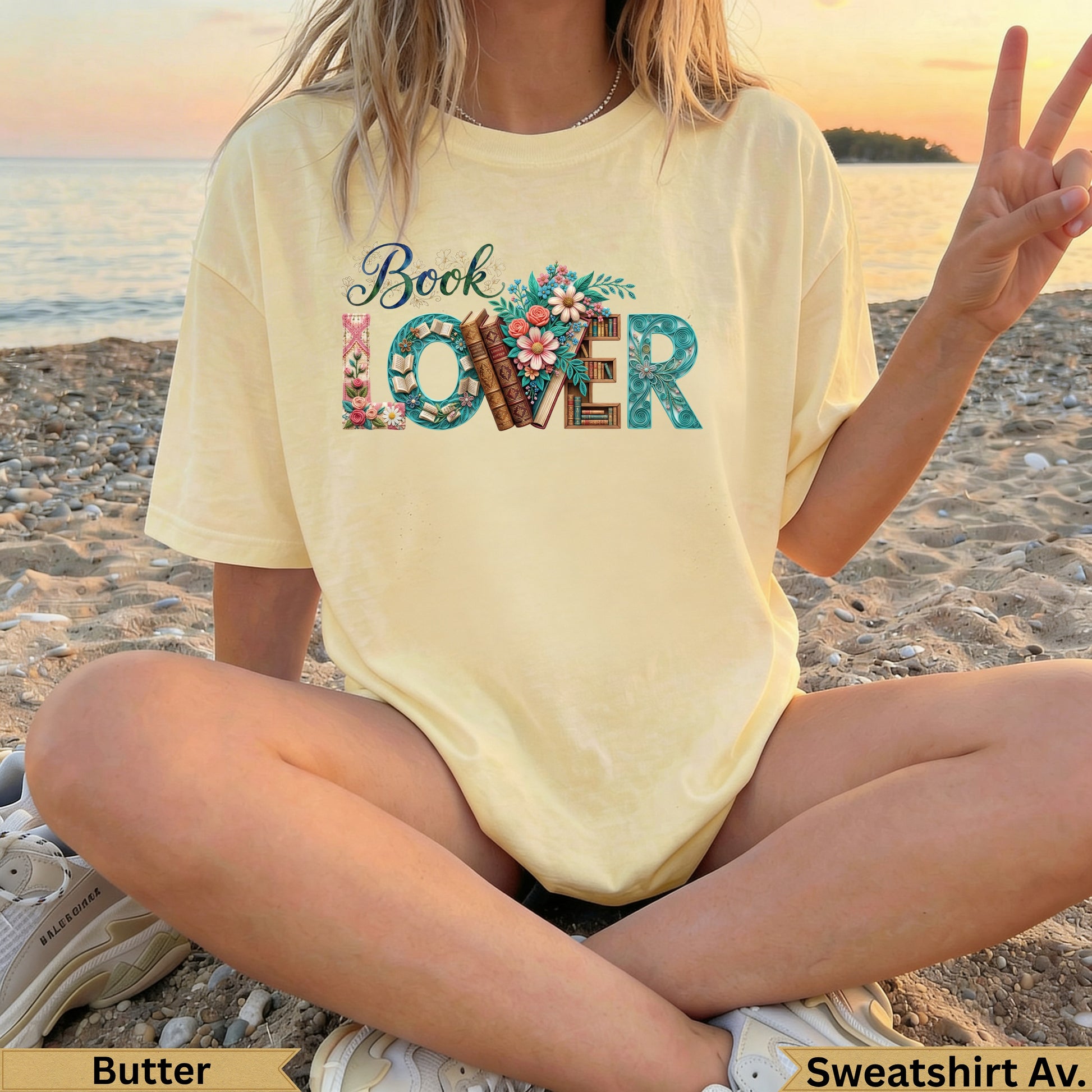 Yellow "Book Lover" t-shirt with floral and book graphics.
