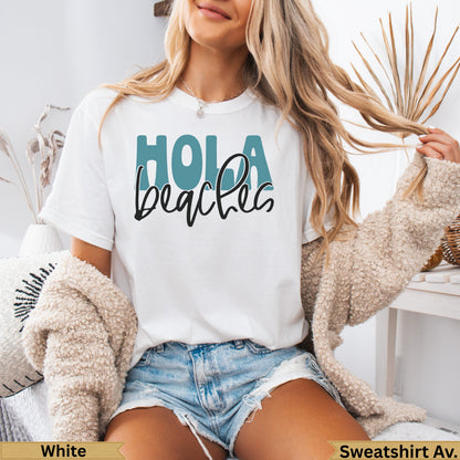 White t-shirt with "Hola beaches" text and distressed denim shorts.