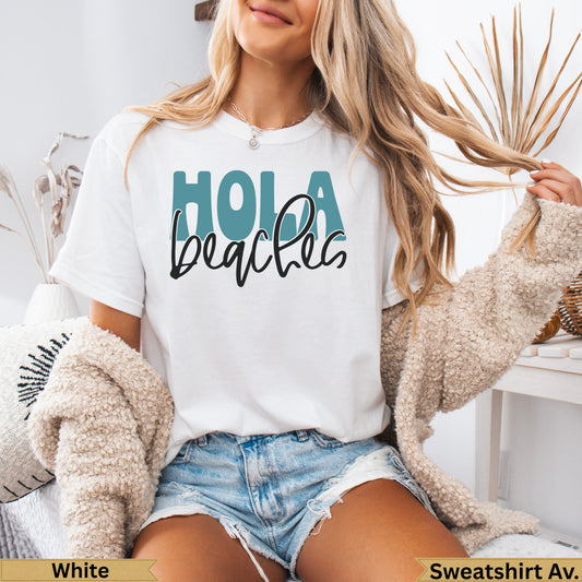 White t-shirt with "Hola beaches" text and distressed denim shorts.