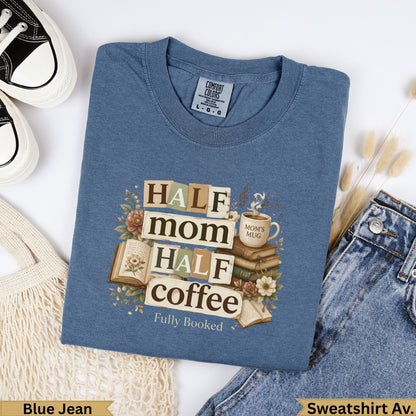 Blue t-shirt with "Half Mom, Half Coffee, Fully Booked" text and books.